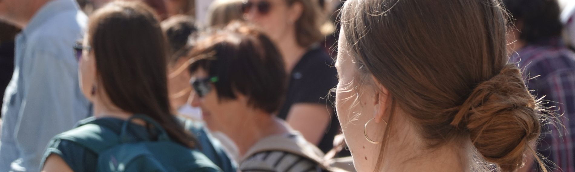 Group of people with a young person in the foreground